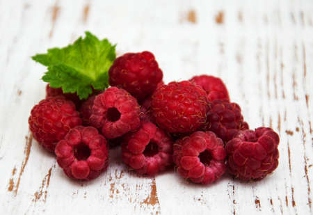 raspberries on a old wooden backgroundの写真素材