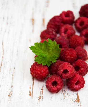 fresh raspberries on a old wooden background
