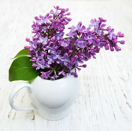 Lilac flowers on a old wooden background
