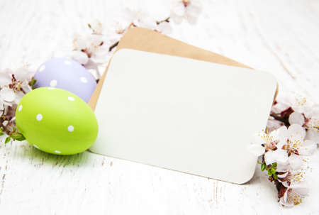 Easter greeting card with cherries blossom and eggsの写真素材