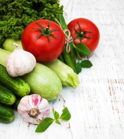 various vegetables on a old wooden backgroundの写真素材