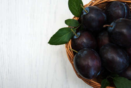 sweet plums on a old wooden backgroundの写真素材