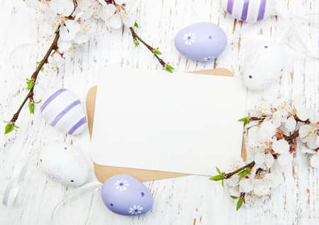 Easter greeting card with cherries blossom and eggs