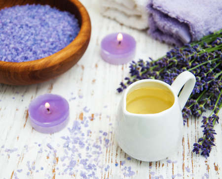 Lavender, sea salt and candle on a wooden backgroundの写真素材