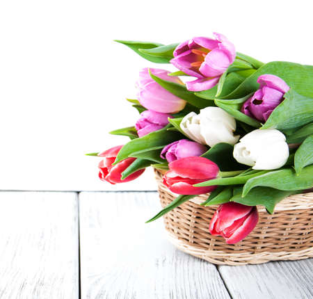 bouquet of tulips on a old wooden tableの写真素材