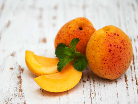 Fresh apricots on a old wooden background