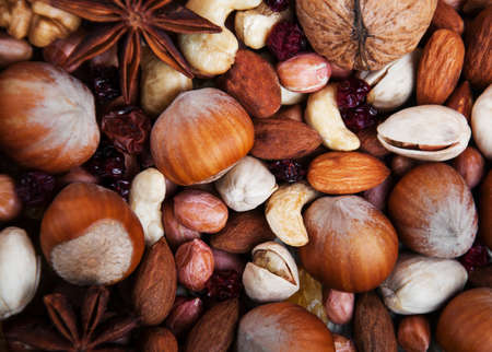 healthy organic mix of nuts and cranberries - food backgroundの写真素材