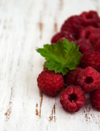 raspberries on a old wooden backgroundの写真素材