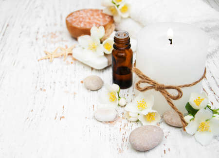 Spa concept with jasmine flowers on a old wooden backgroundの写真素材