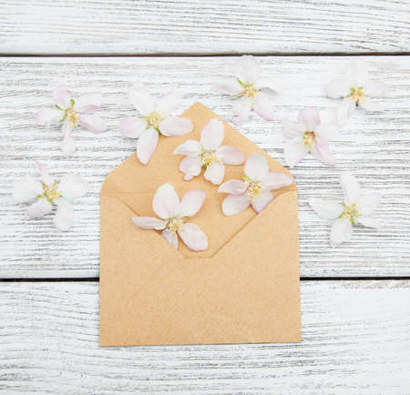 flowers and envelope on a old wooden backgroundの写真素材