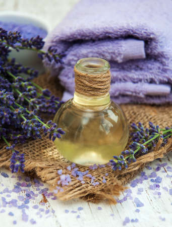 Lavender, sea salt and oil on a wooden backgroundの写真素材