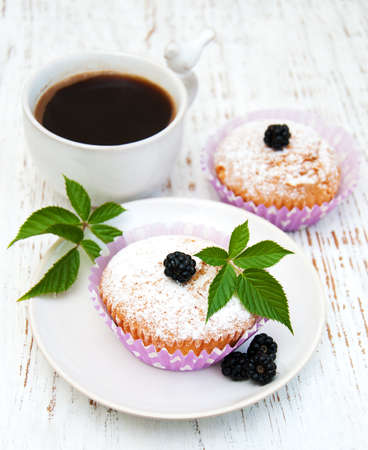 muffins with blackberry on a old wooden backgroundの写真素材