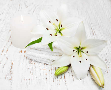 Spa products with white lily on a old wooden backgroundの写真素材