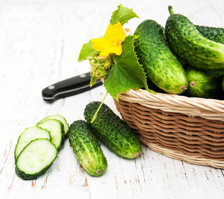 Fresh cucumbers on a old wooden backgroundの写真素材