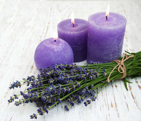 Lavender and candles on a wooden backgroundの写真素材