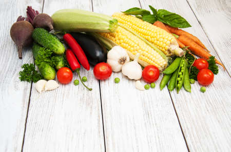 Fresh summer vegetables on a old wooden backgroundの写真素材