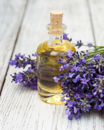 Lavender and massage oil on a old wooden backgroundの写真素材