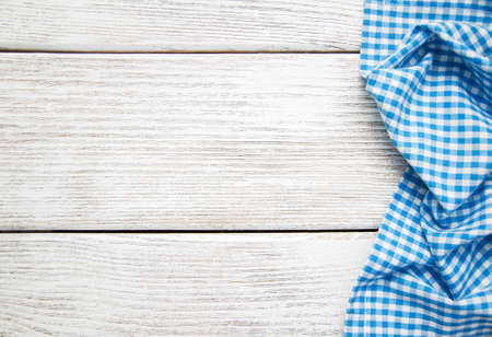 Blue napkin on the old wooden backgroundの写真素材