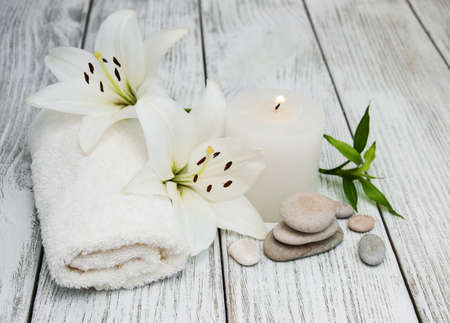 Spa products with white lily on a old wooden backgroundの写真素材