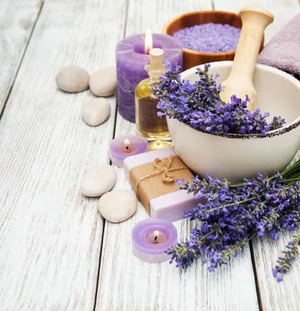 Spa products and lavender flowers on a old wooden backgroundの写真素材
