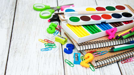 school office supplies  on a old wooden tableの写真素材