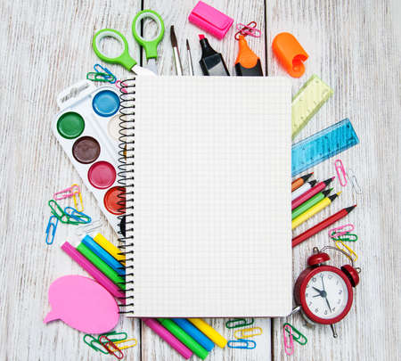 school office supplies  on a old wooden tableの写真素材