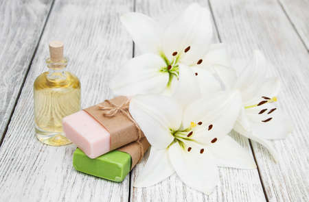 Wellness and spa scene with lily and massage oilの写真素材