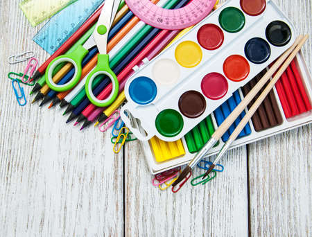 school office supplies  on a old wooden tableの写真素材
