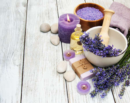 Spa products and lavender flowers on a old wooden backgroundの写真素材