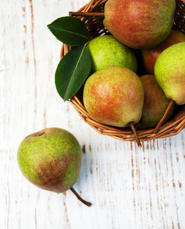 Fresh pears on a old wooden backgroundの写真素材