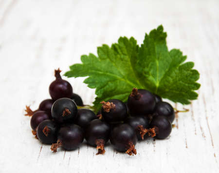 black currant on a wooden backgroundの写真素材