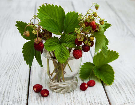 Glass with wild strawberriesの写真素材