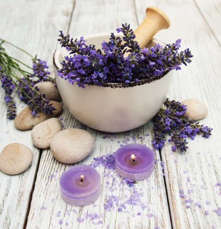 Spa products and lavender flowers on a old wooden backgroundの写真素材