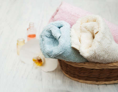 Orchids, oils and  towels on a old wooden backgroundの写真素材