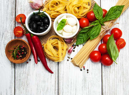 italian food ingredients on a old wooden backgroundの写真素材