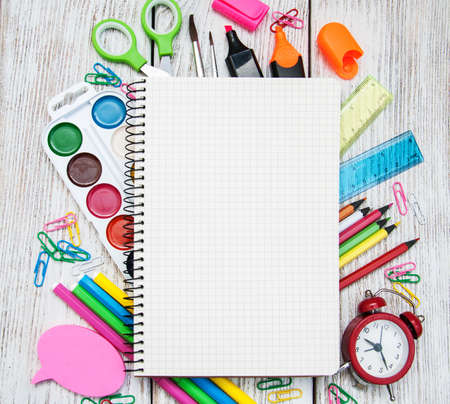 school office supplies  on a old wooden tableの写真素材