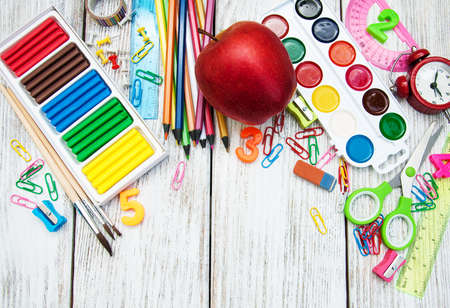 school office supplies  on a old wooden tableの写真素材