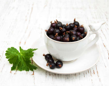 black currant on a wooden backgroundの写真素材