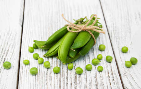 green peas  on rustic white wooden backgroundの写真素材