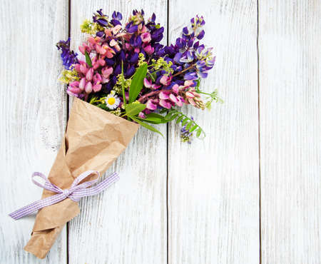 Lupine flowers on a old wooden tableの写真素材