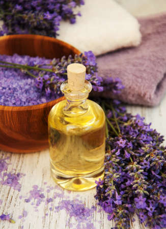 Lavender and massage oil on a old wooden backgroundの写真素材