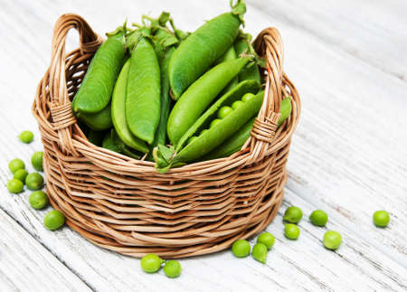 green peas  on rustic white wooden backgroundの写真素材