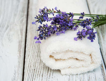 Lavender and massage towell on a old wooden backgroundの写真素材