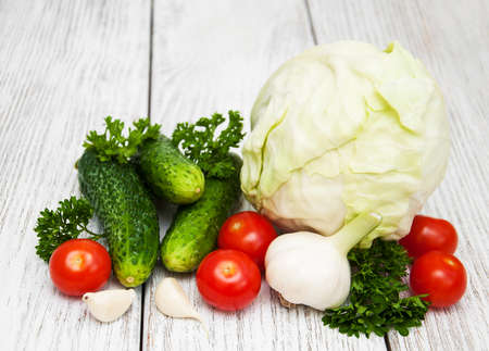 Fresh summer vegetables on a old wooden backgroundの写真素材
