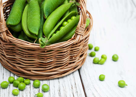 green peas  on rustic white wooden backgroundの写真素材