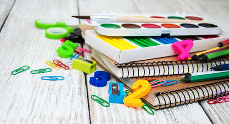 school office supplies  on a old wooden tableの写真素材