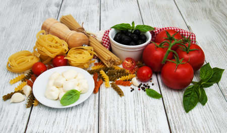 italian food ingredients on a old wooden backgroundの写真素材