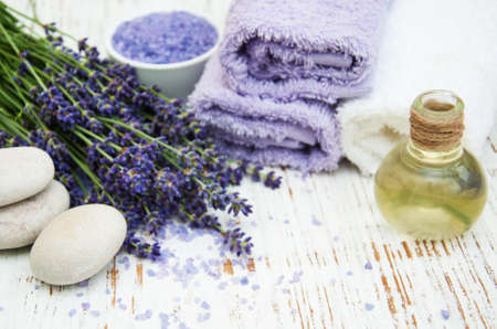 Spa products and lavender flowers on a old wooden backgroundの写真素材