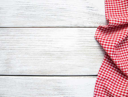 Red napkin on the old wooden backgroundの写真素材