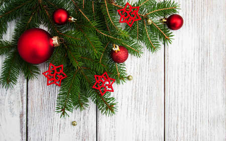 christmas fir tree with decoration on a wooden boardの写真素材